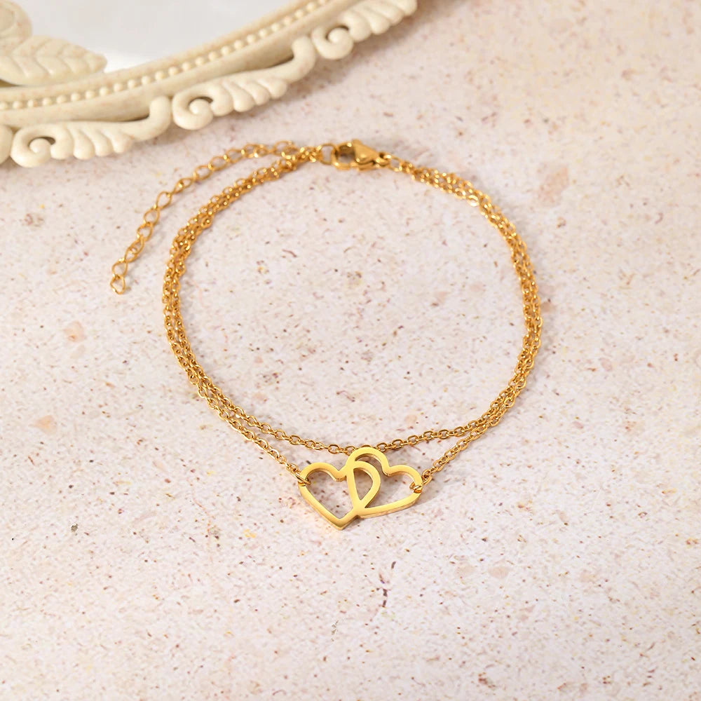 Pulsera Doble Corazón Entrelazado en Acero Inoxidable