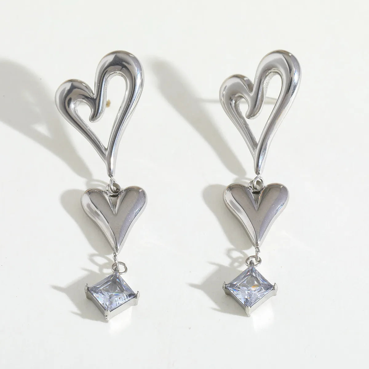 Aretes de Doble Corazón en Acero Inoxidable Chapado en Oro